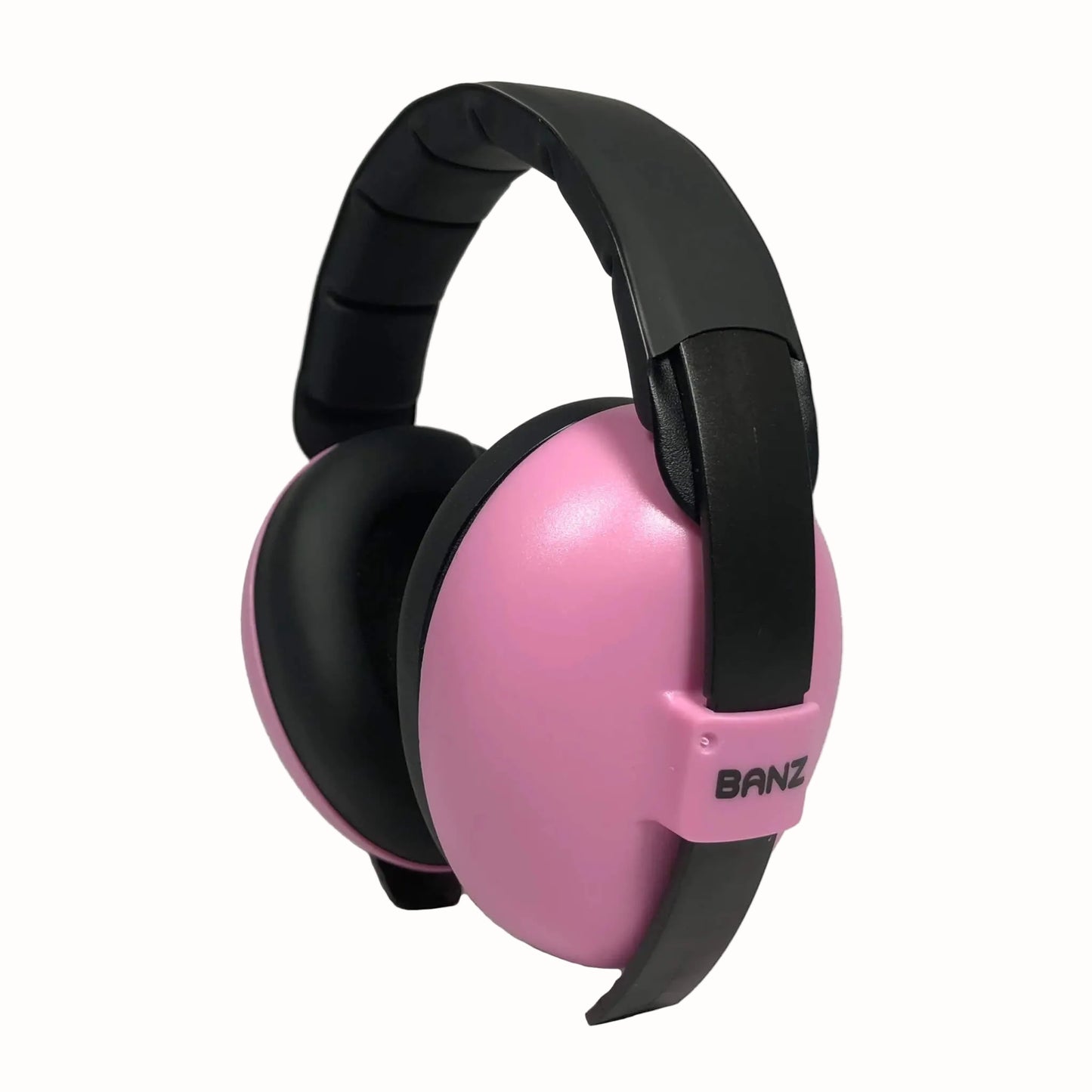 A side view of pink and black baby earmuffs showing the BANZ logo and padded headband.