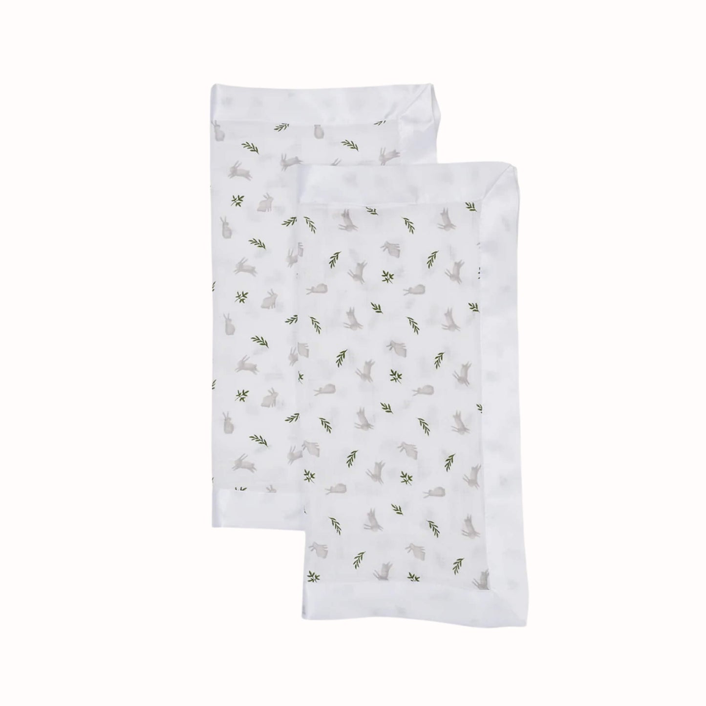 Two soft square security blankets with knotted corners displayed overlapping, featuring a white background with grey bunny and green leaf print.