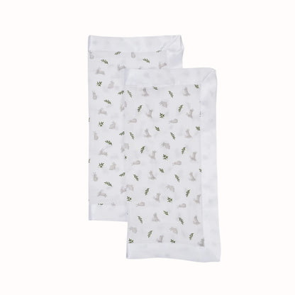 Two soft square security blankets with knotted corners displayed overlapping, featuring a white background with grey bunny and green leaf print.