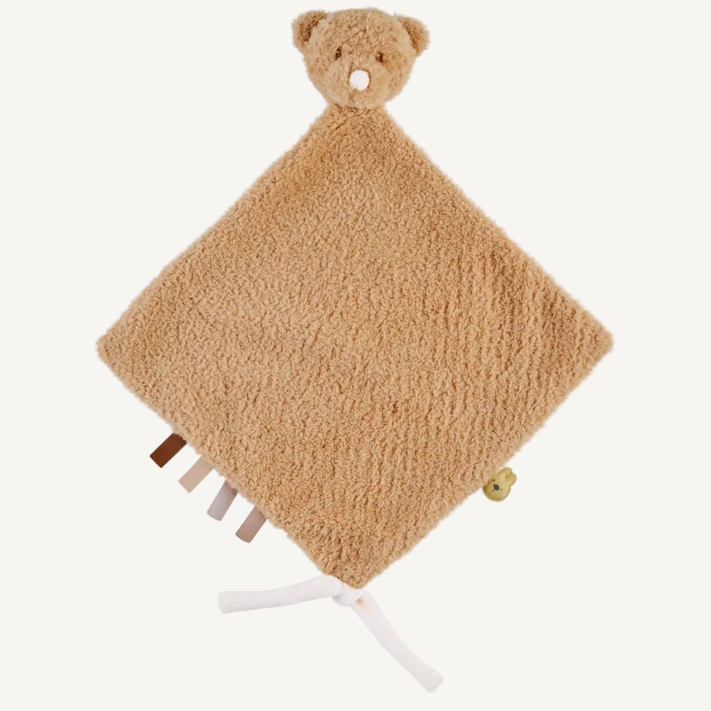 Soft beige teddy bear comforter blanket with textured fabric, ribbon tags and knotted corners shown against a light background.