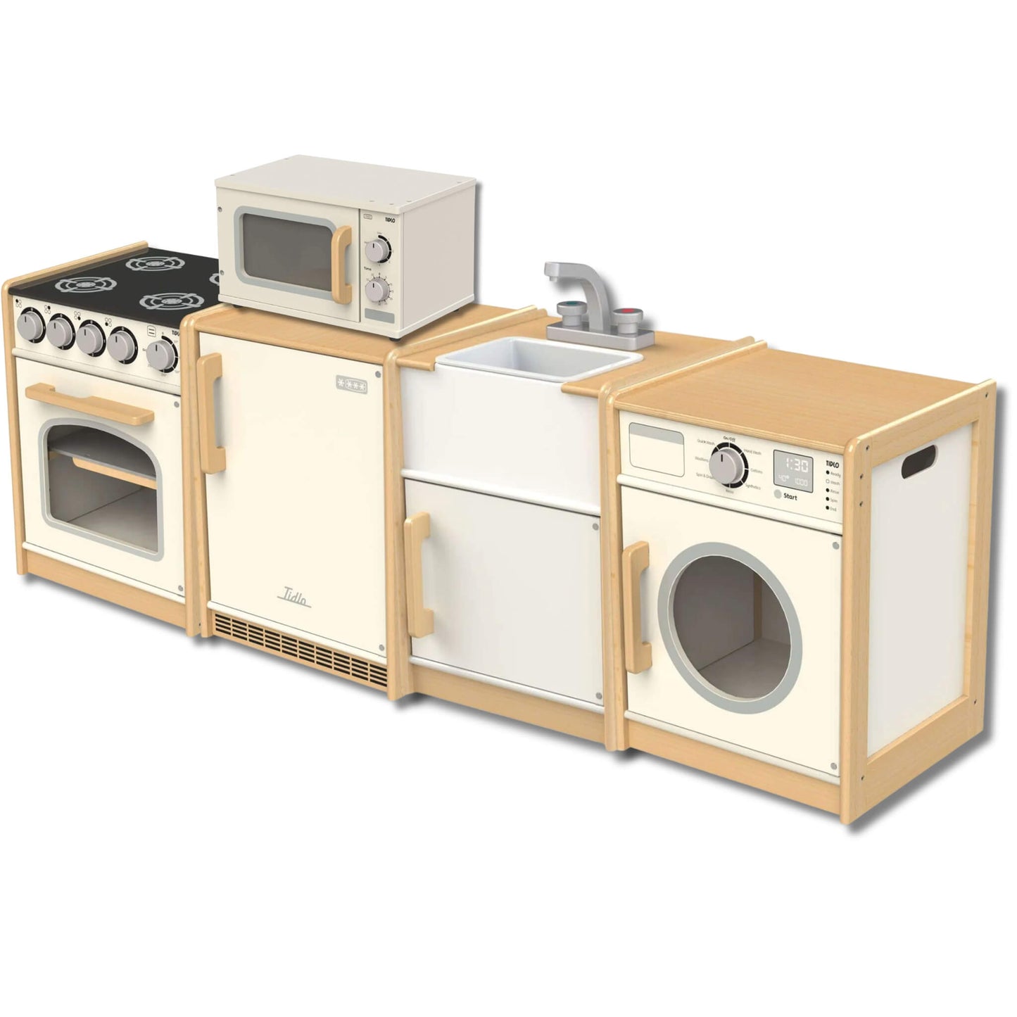 Wooden children’s play kitchen set arranged in a row, featuring an oven with hob, fridge, sink with tap, washing machine, and a microwave placed on top, in neutral cream and natural wood tones.