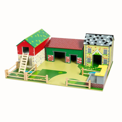 Wooden Oldfield Farm playset with farmhouse, barn, fenced paddocks and feeding area for imaginative farmyard play.