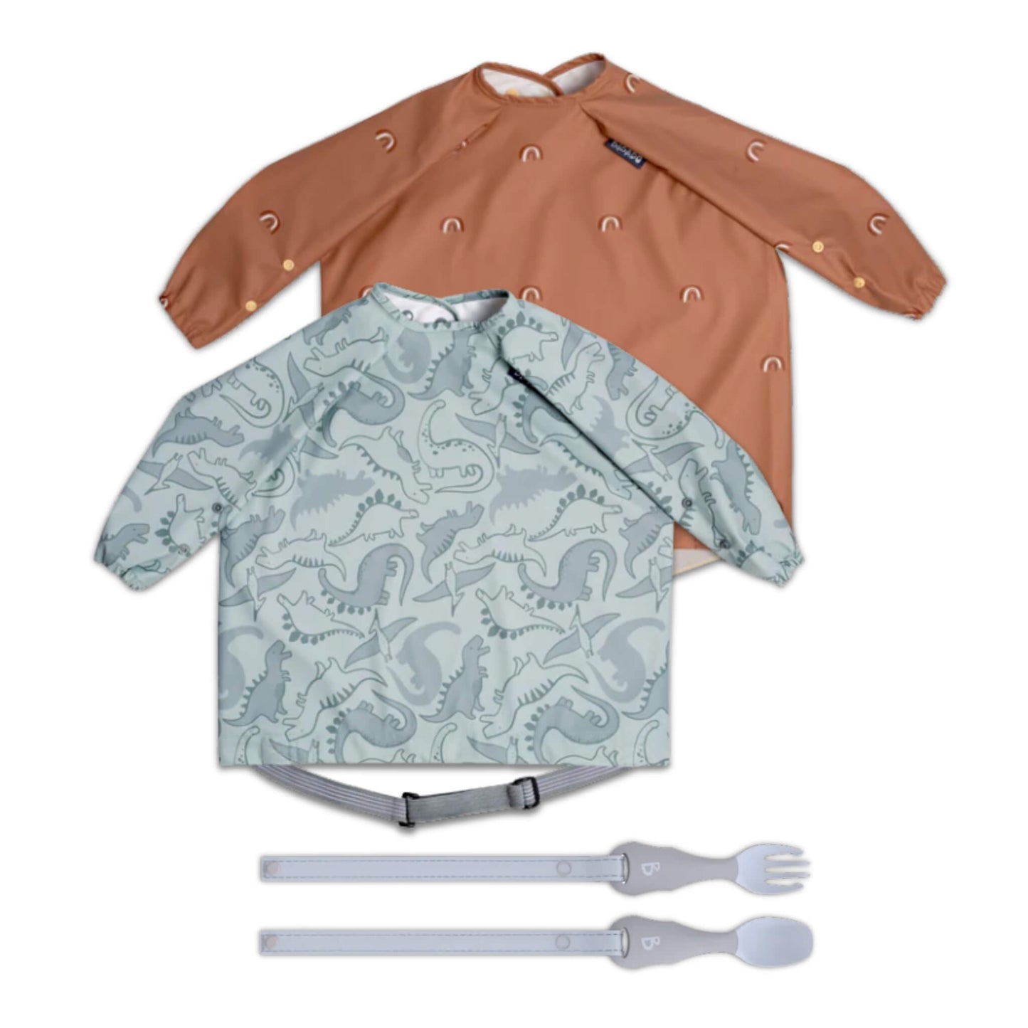 Bibado Long Sleeve Coverall Bib & Weaning Cutlery Bundle with two full-coverage sleeved bibs in rust rainbow and sage dinosaur prints and matching attachable fork and spoon set laid flat.