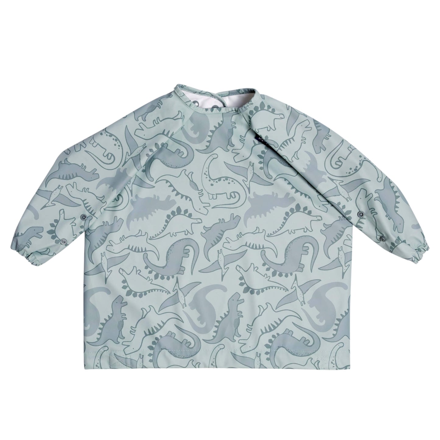 Dino Roar Bibado bib laid flat without the strap, showing full sleeve coverage and dinosaur-themed print on soft sage green fabric.