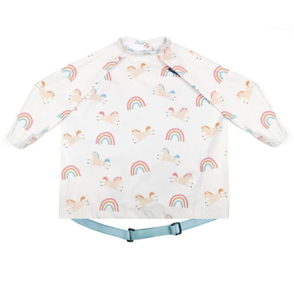 Bibado Coverall Bib in Fairytale Foodies print, featuring a white long-sleeved weaning bib with colourful unicorn and rainbow print, elasticated cuffs and an adjustable blue neck fastening.
