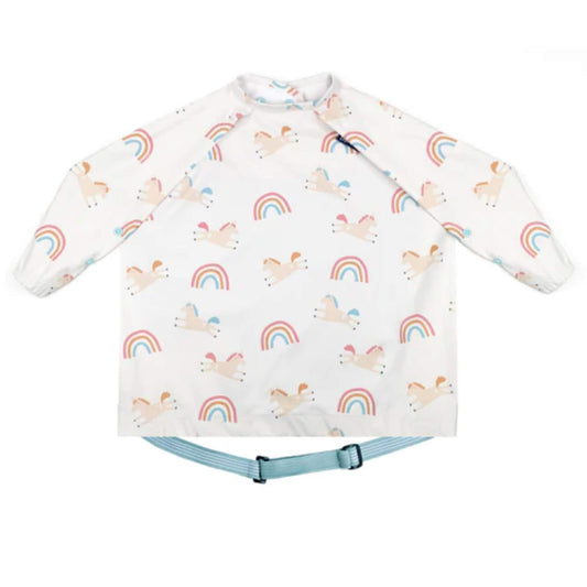 Bibado Coverall Bib in Fairytale Foodies print, featuring a white long-sleeved weaning bib with colourful unicorn and rainbow print, elasticated cuffs and an adjustable blue neck fastening.