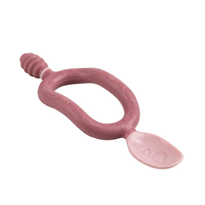 Side angle of the Bibado Dippit spoon showing the curved ergonomic handle and textured dipper end.