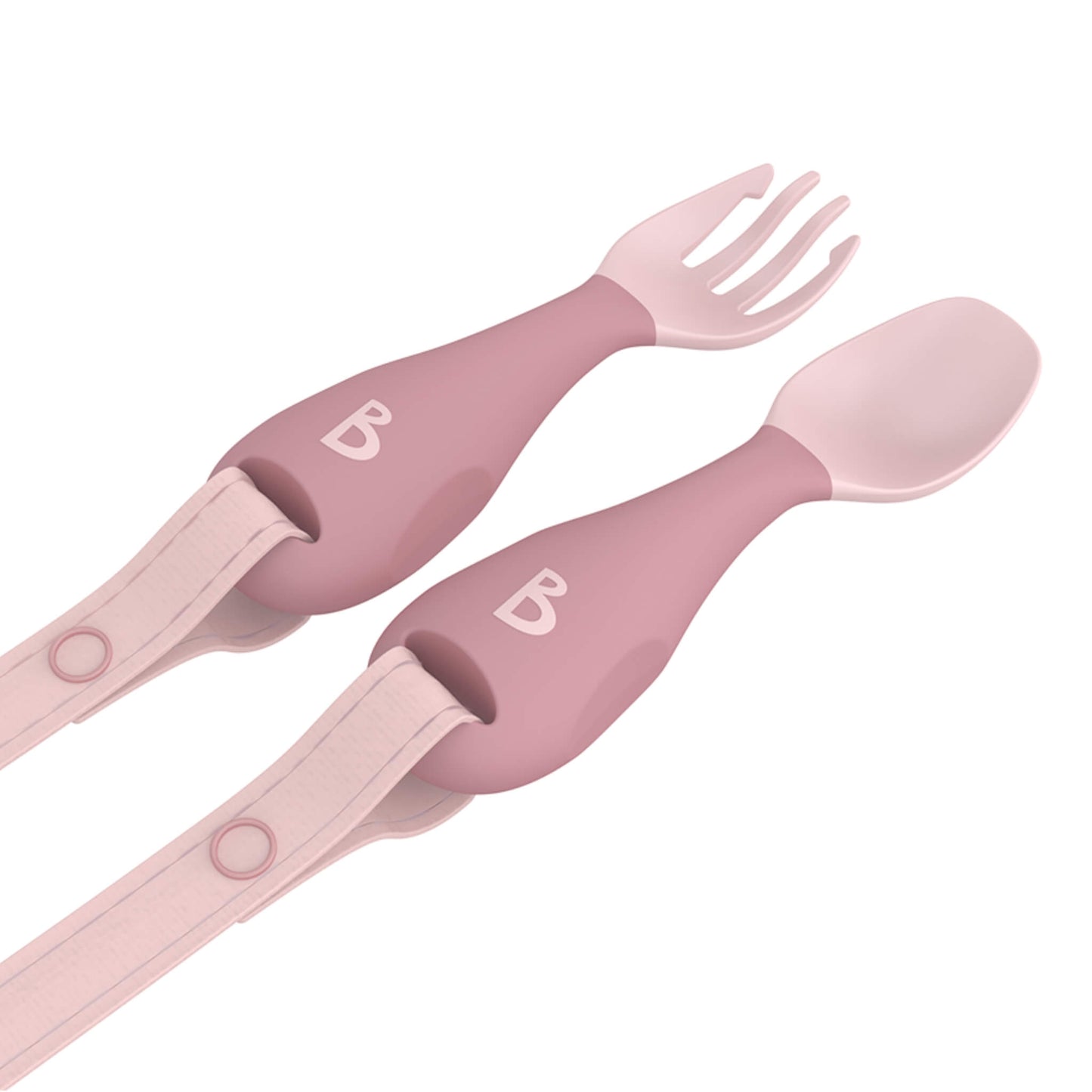Angled view of blush pink weaning cutlery set with chunky soft-grip handles and detachable safety straps.
