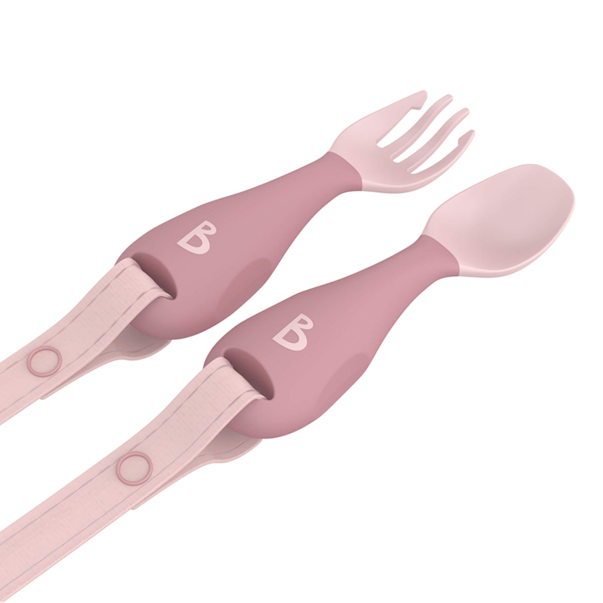 Angled view of blush pink weaning cutlery set with chunky soft-grip handles and detachable safety straps.