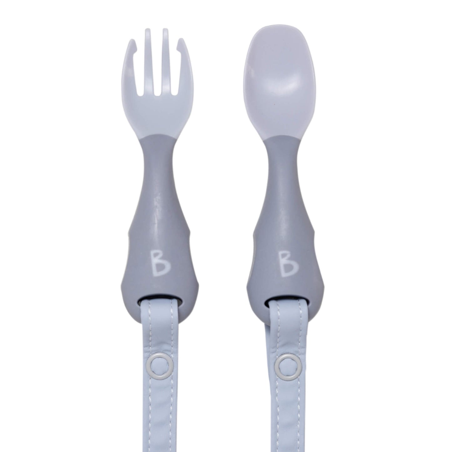 Bibado Handi Cutlery in Mist with soft grey spoon and fork set laid flat, popper straps attached for no-drop mealtimes.