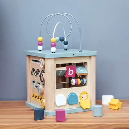Wooden activity cube with bead maze, number tiles, and shape sorter, designed for toddler learning and fine motor skill development.
