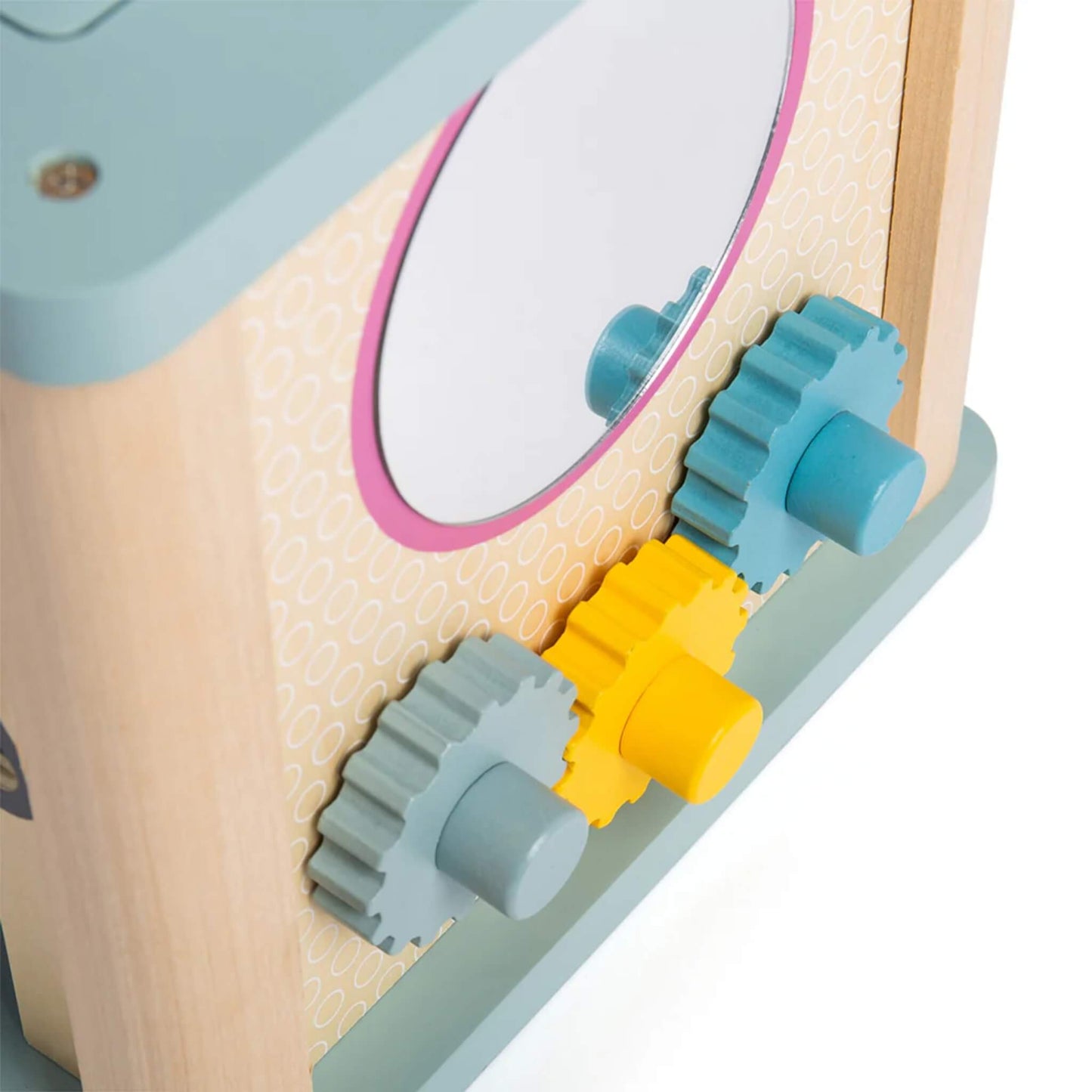 Detail of spinning cogs and mirror on the wooden activity cube, encouraging problem-solving and sensory exploration.