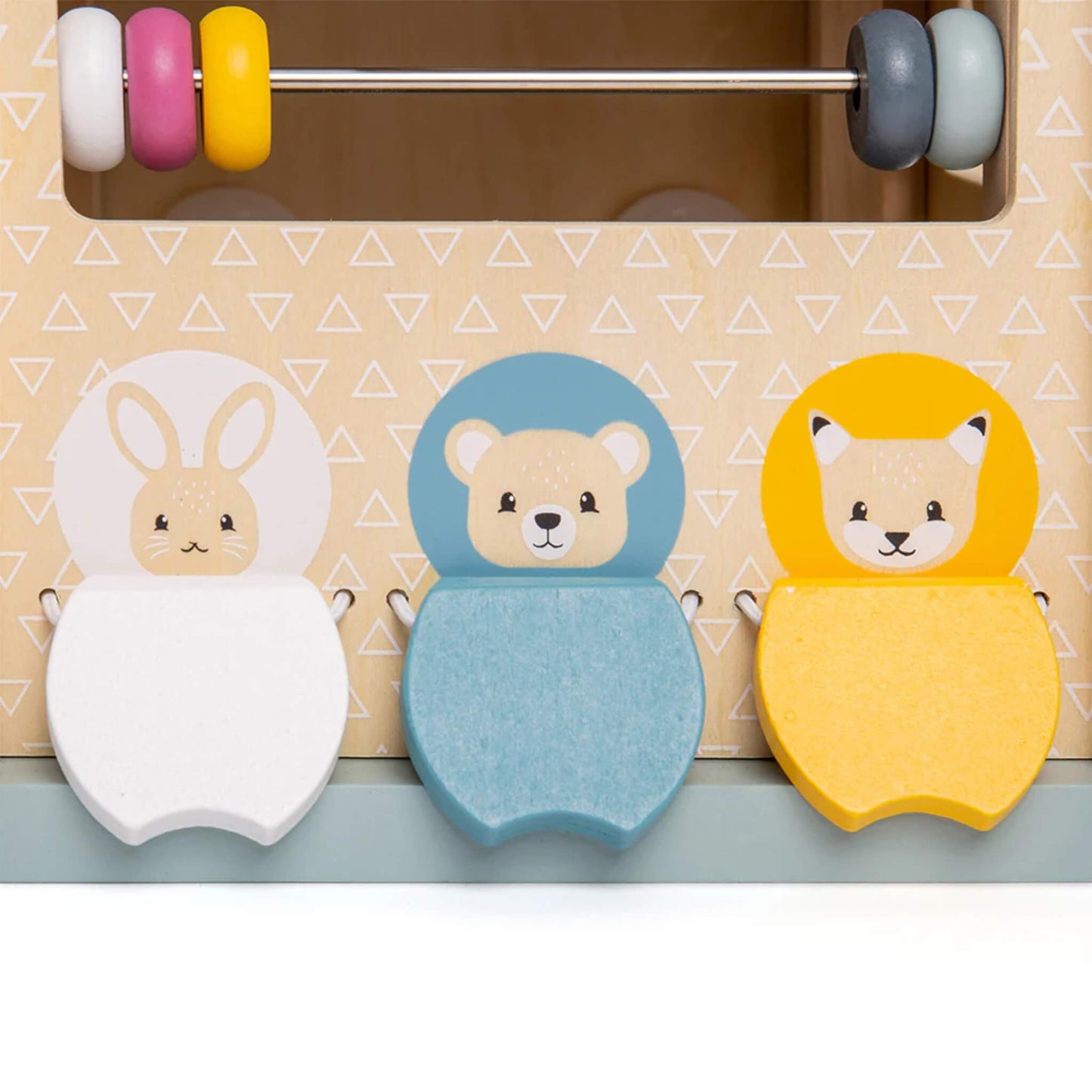 Three wooden animal tiles – rabbit, bear, and fox – on the side of an activity cube, promoting imaginative play and shape matching.