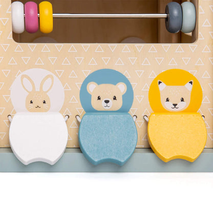 Three wooden animal tiles – rabbit, bear, and fox – on the side of an activity cube, promoting imaginative play and shape matching.