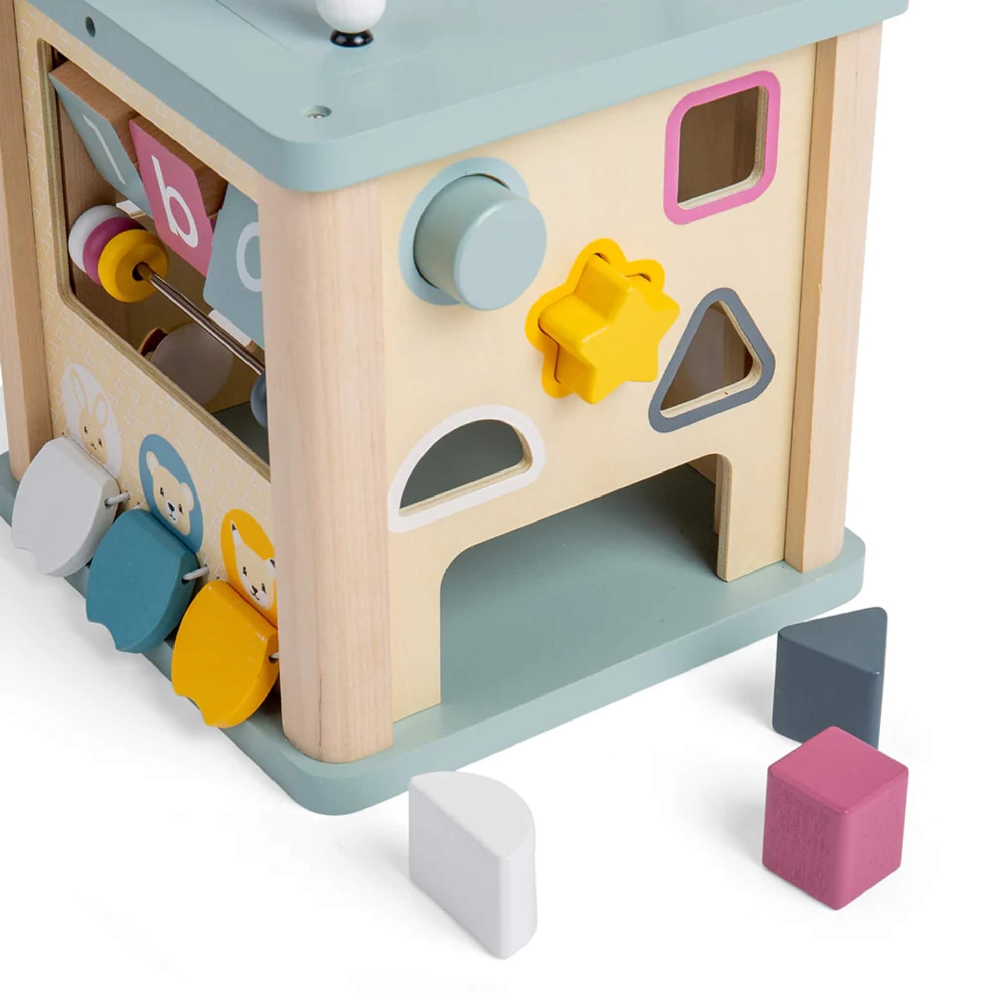 Shape sorter side of the wooden activity cube, featuring brightly coloured blocks for hand-eye coordination and problem-solving.