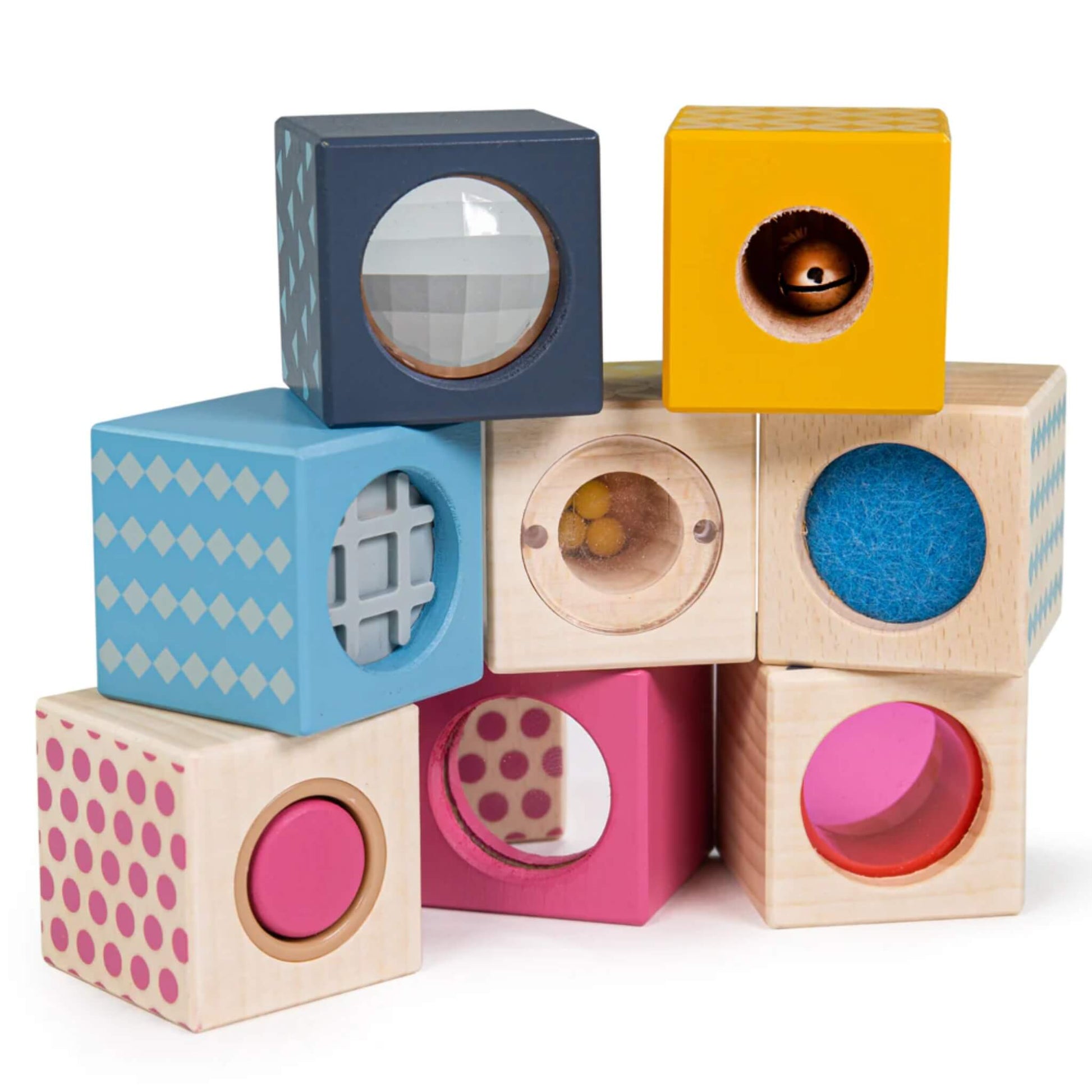 A stack of eight colourful Bigjigs FSC® Certified Sensory Blocks, each with a unique feature including felt, a bell, prism, rattle balls, and viewfinders.