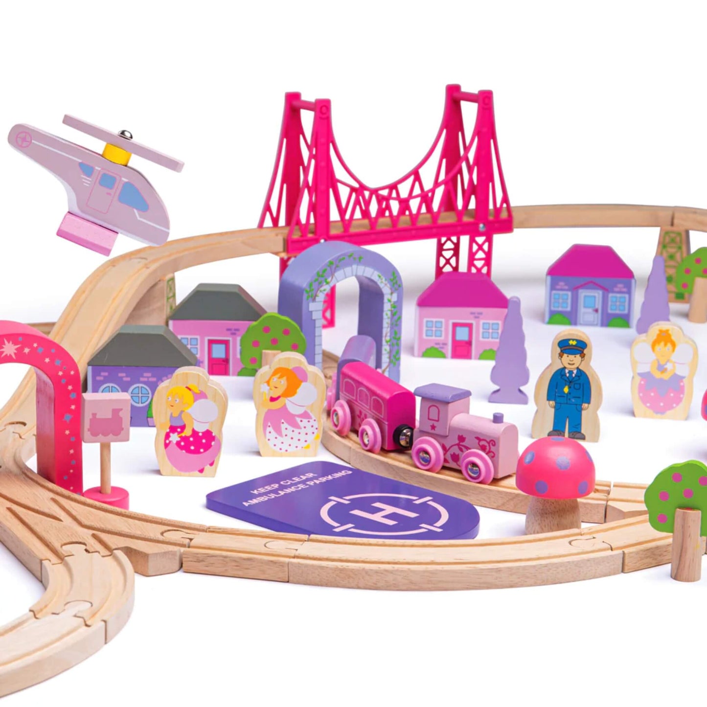 Close-up of the train track near the helipad, with pink train carriages, fairies, mushroom signs, colourful houses, and the fairy helicopter above.