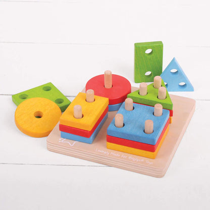 Close-up of the Bigjigs Toys First Four Shape Sorter – a sturdy wooden baseboard with brightly coloured stacking shapes.
