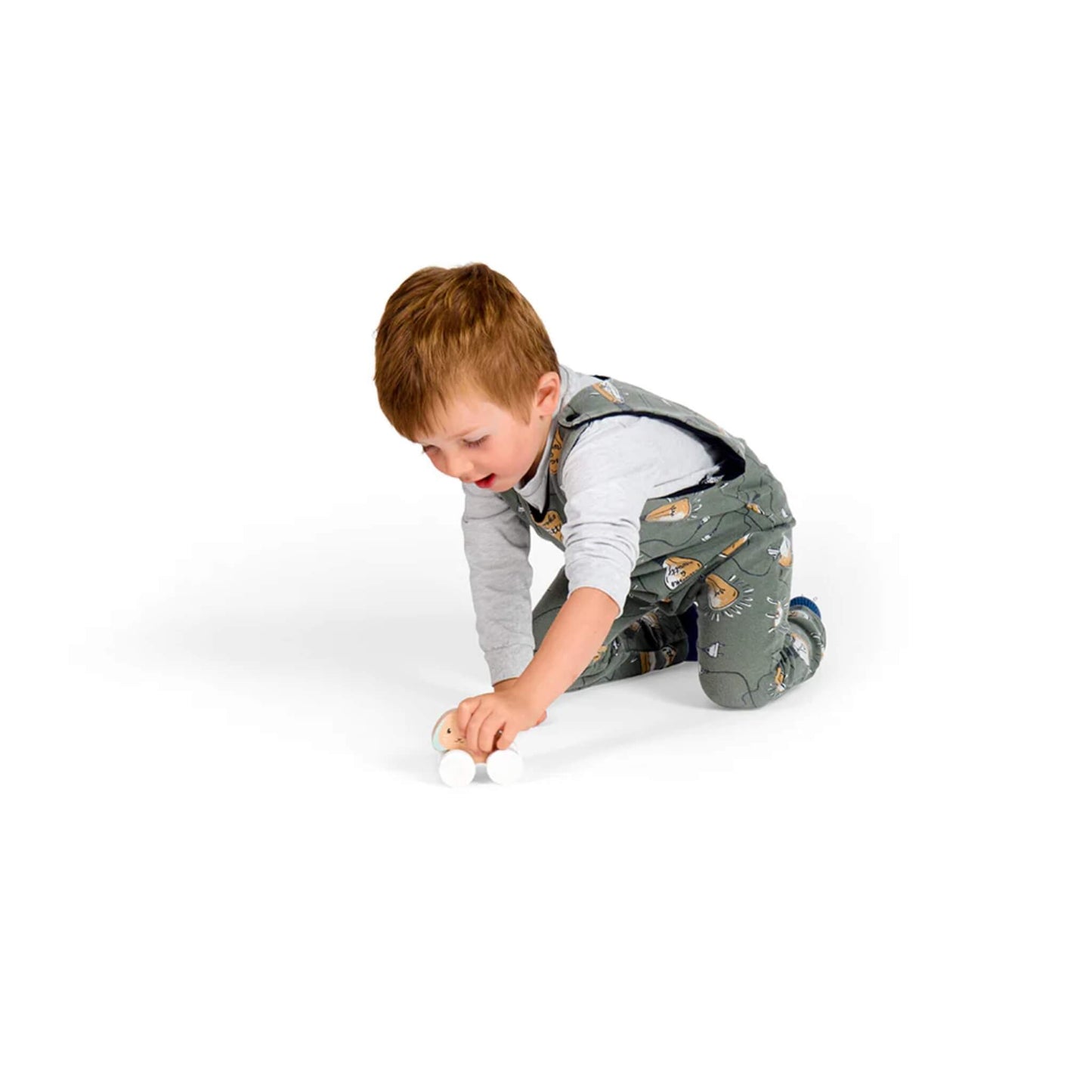Young boy pushing the baby bunny toy separately, showing how the smaller bunny can be used for independent play.