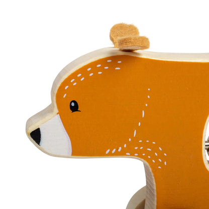 Close-up of the bear’s head, highlighting the soft felt ears and hand-painted facial details on the natural wood finish.