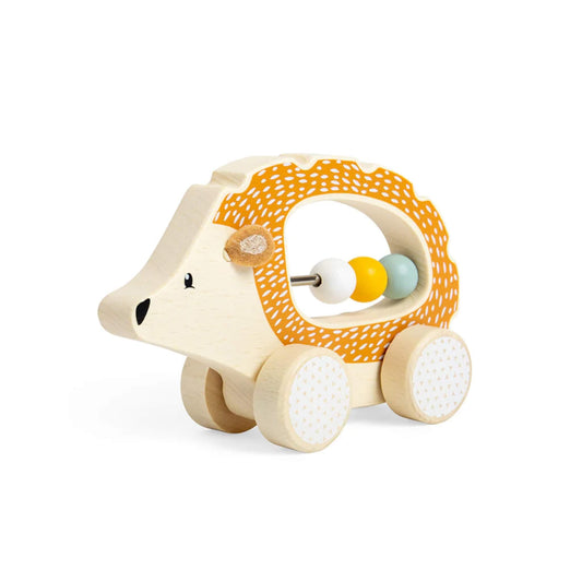 Angled view of the Push Along Hedgehog toy showing its curved wooden shape, dotted orange 'spikes,' and smooth-rolling wheels.