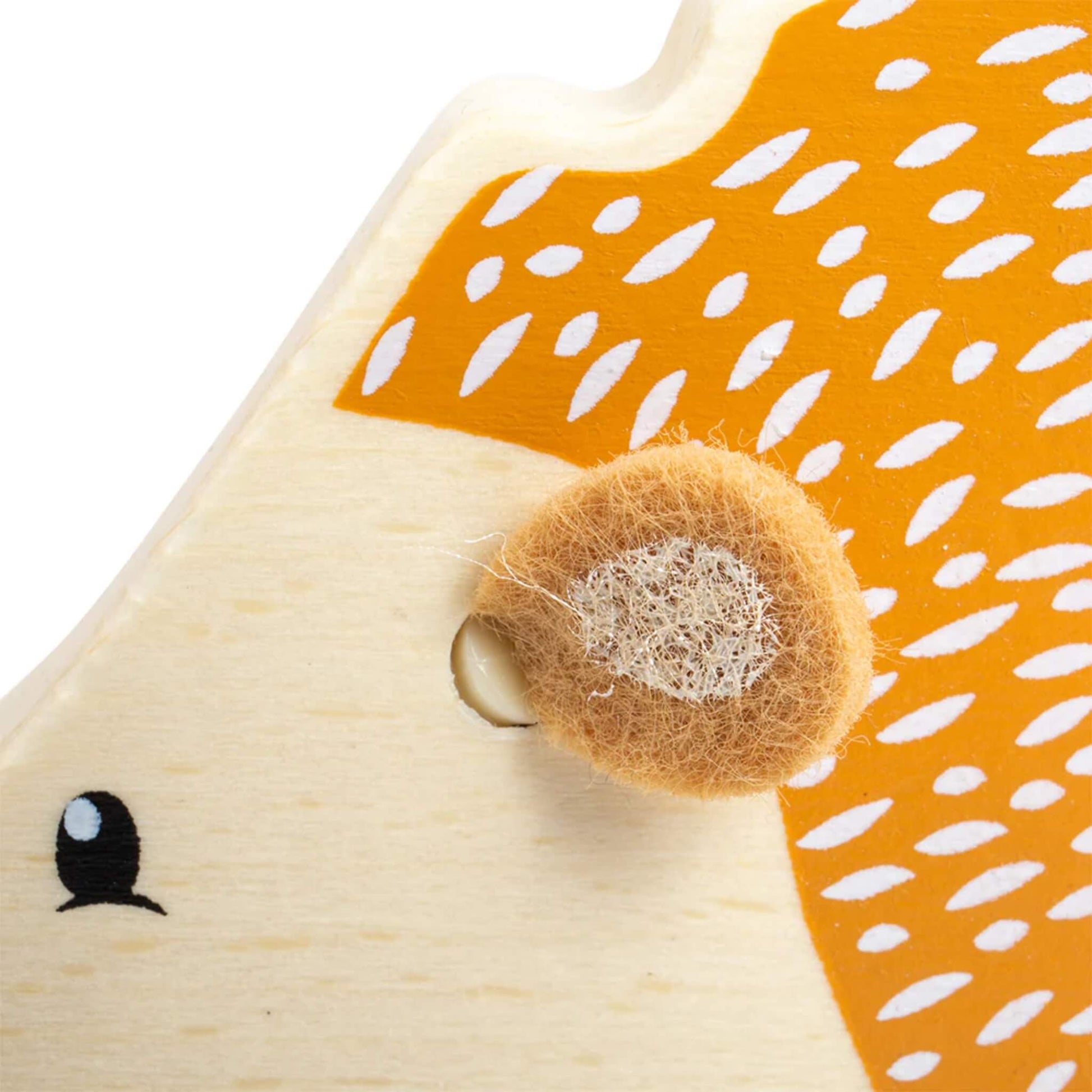 Close-up of the hedgehog’s soft felt ear, highlighting the contrast in texture for sensory exploration.