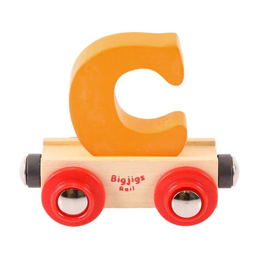 Orange wooden rail name letter C, set upon a wooden carriage.