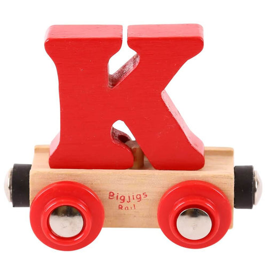 A red wooden toy train carriage with a brightly colored wooden letter 'K' inside, on a clear background.