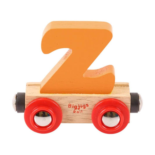 A wooden train set letter 'Z' carrier with red wheels and a natural wood body.