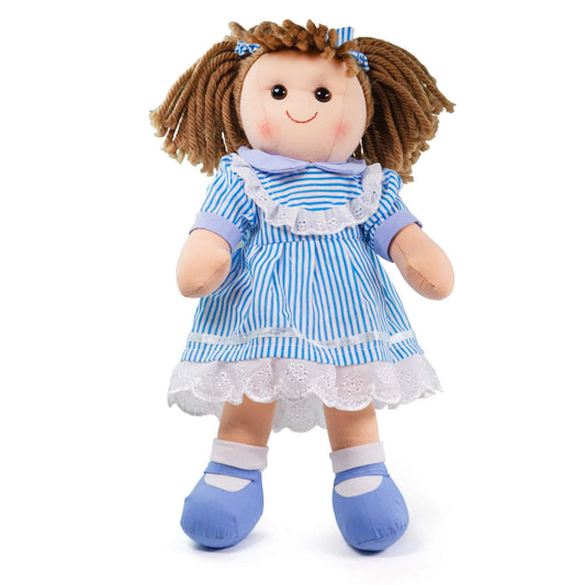 Bigjigs Toys Amelia Doll shown standing, wearing a blue and white striped dress with lace trim and matching bows in her brown yarn hair.