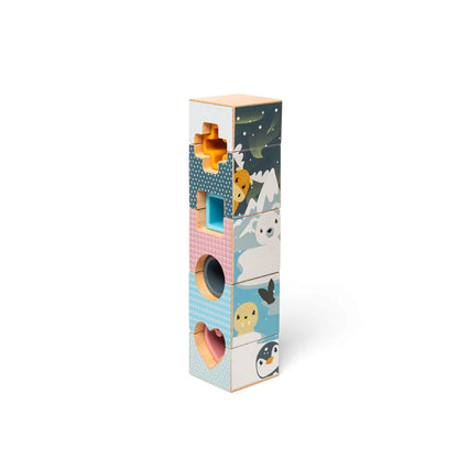 Stacked tower of Arctic-themed blocks with vibrant illustrations, including penguins, polar bears, and snowy mountain scenes.