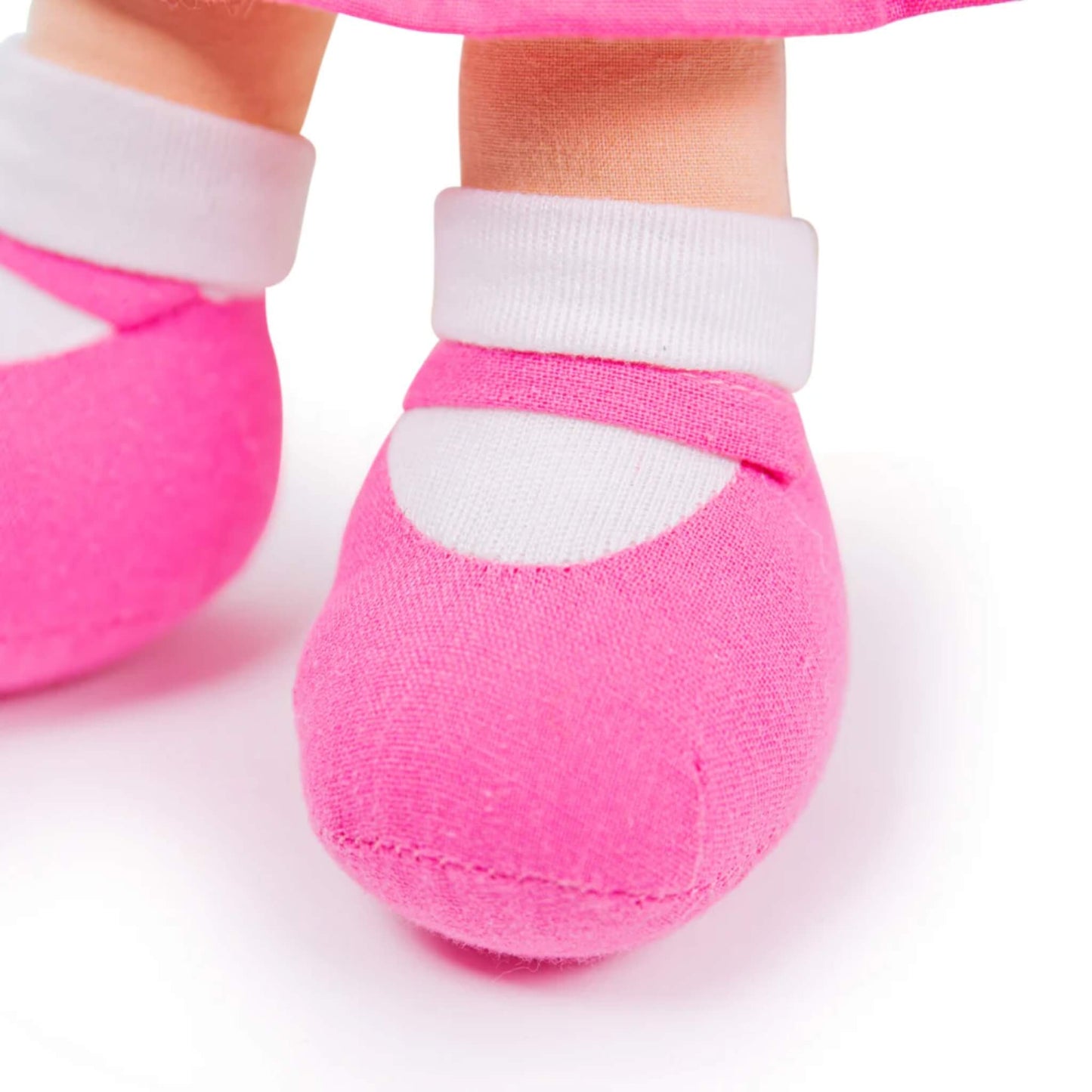 Detailed view of the doll’s soft pink shoes and white ankle cuffs, stitched neatly for durability.