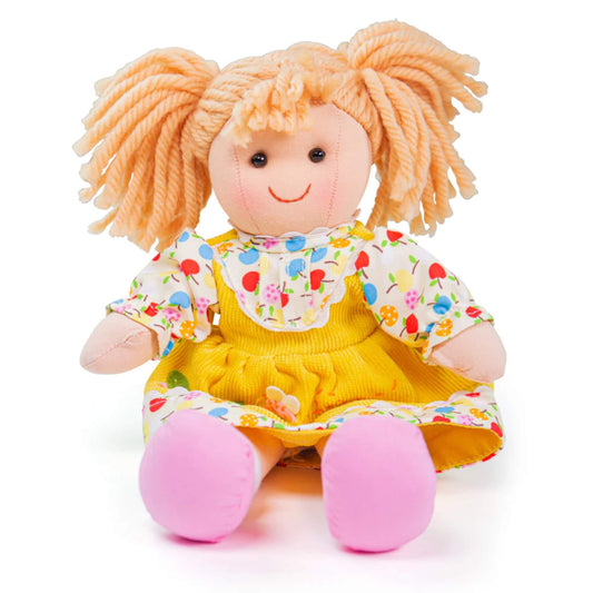 Soft rag doll seated with legs outstretched, showing pink shoes and a colourful floral outfit.