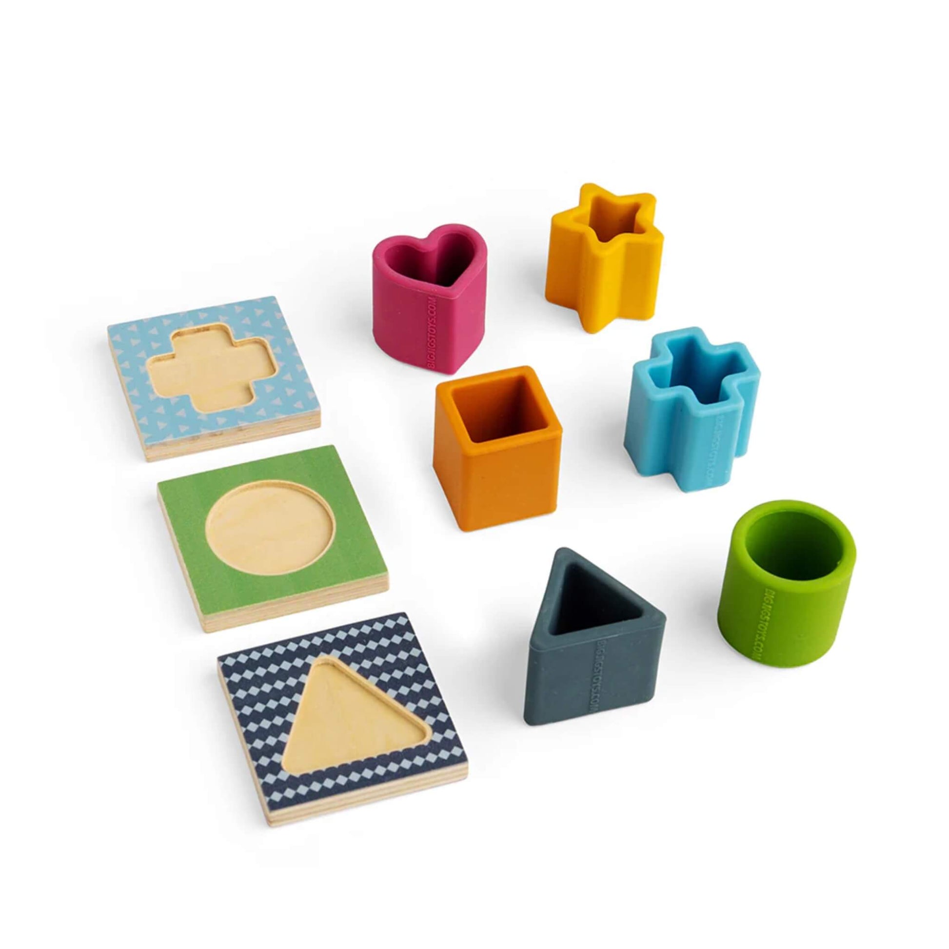 Six colourful silicone shapes and three double-sided wooden matching tiles laid out for shape sorting.