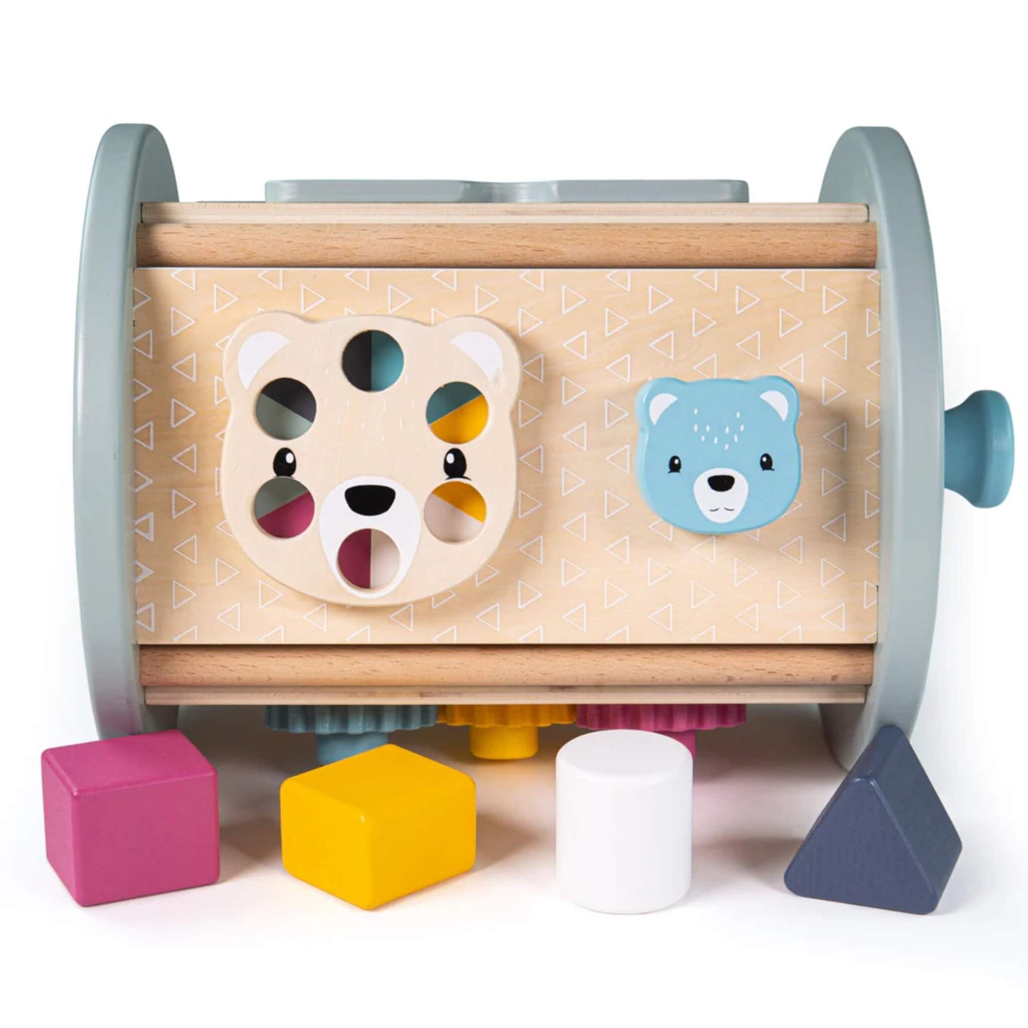 Side view of the rolling activity sorter lying on its side, featuring a bear face dial and a blue animal knob, with shape blocks arranged nearby.