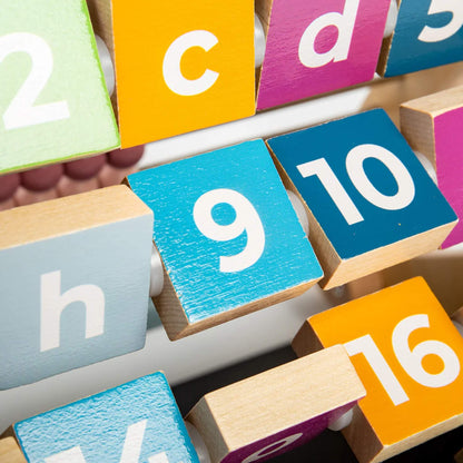 Brightly coloured numbered wooden blocks in motion, helping children learn to count from 1–29.