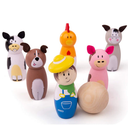 Bigjigs Toys Farm Skittles set with six colourful wooden figures—a farmer and five farm animals—lined up with a natural wooden ball in front.