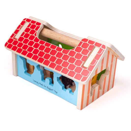 Brightly coloured farmhouse shape sorter with chunky wooden animal pieces, including a horse, duck, pig, and cow.