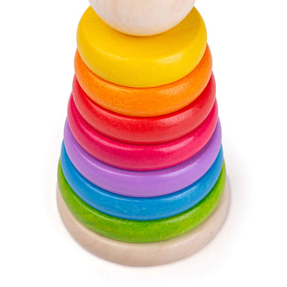 Close-up of brightly coloured wooden rings stacked in a rainbow pattern – perfect for little hands.