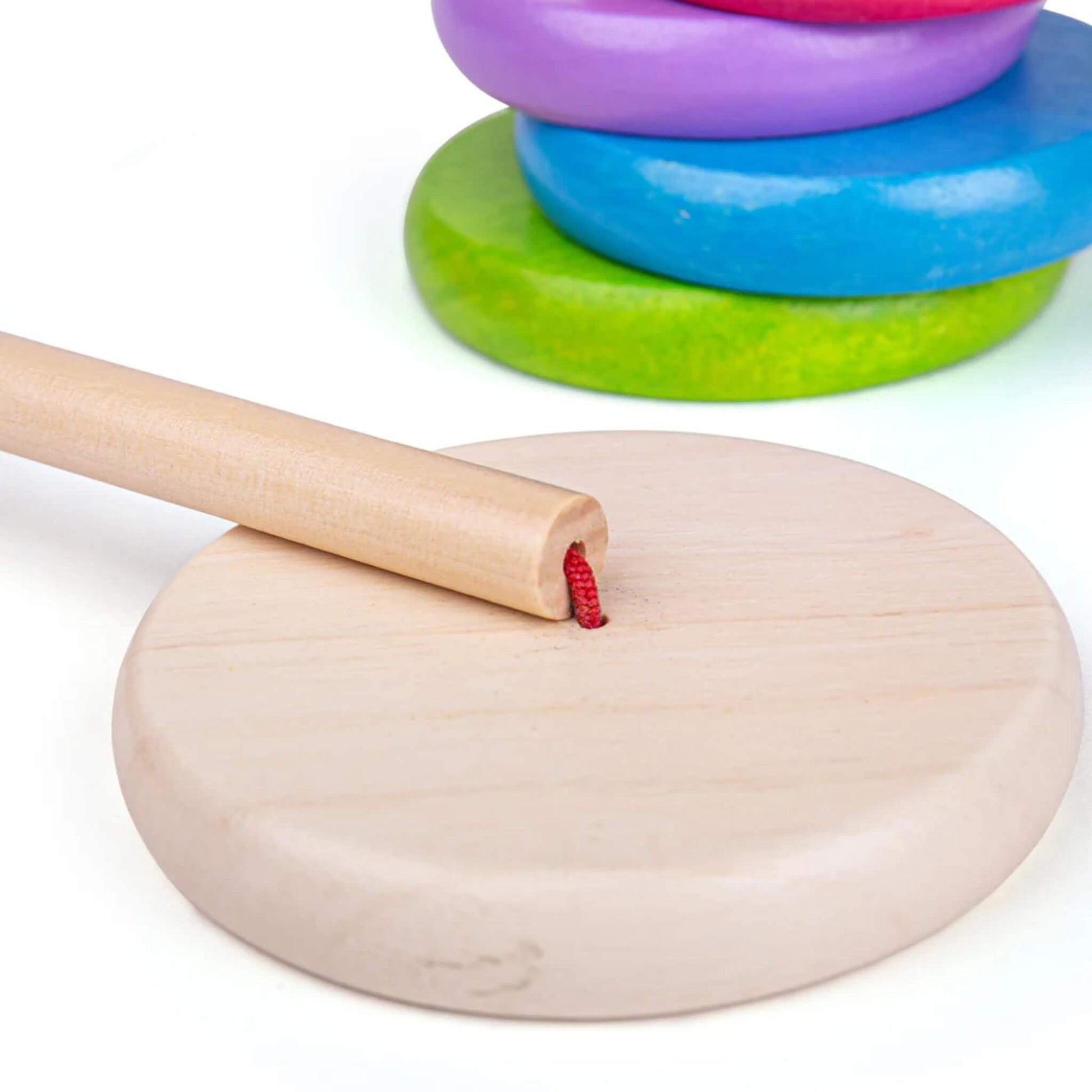 Smooth wooden stacking base and detached rod – a sturdy foundation for creative stacking.