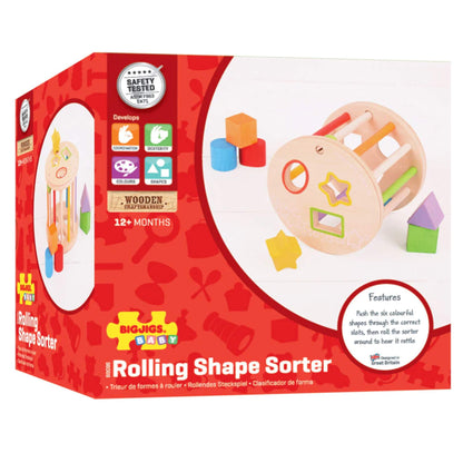 Bigjigs Toys First Rolling Shape Sorter in its bright red retail packaging, highlighting key features and developmental benefits.