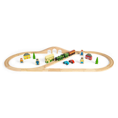 Wooden Bigjigs Toys Flying Scotsman Train Set with green engine, station, cars, and wooden people laid out for play.