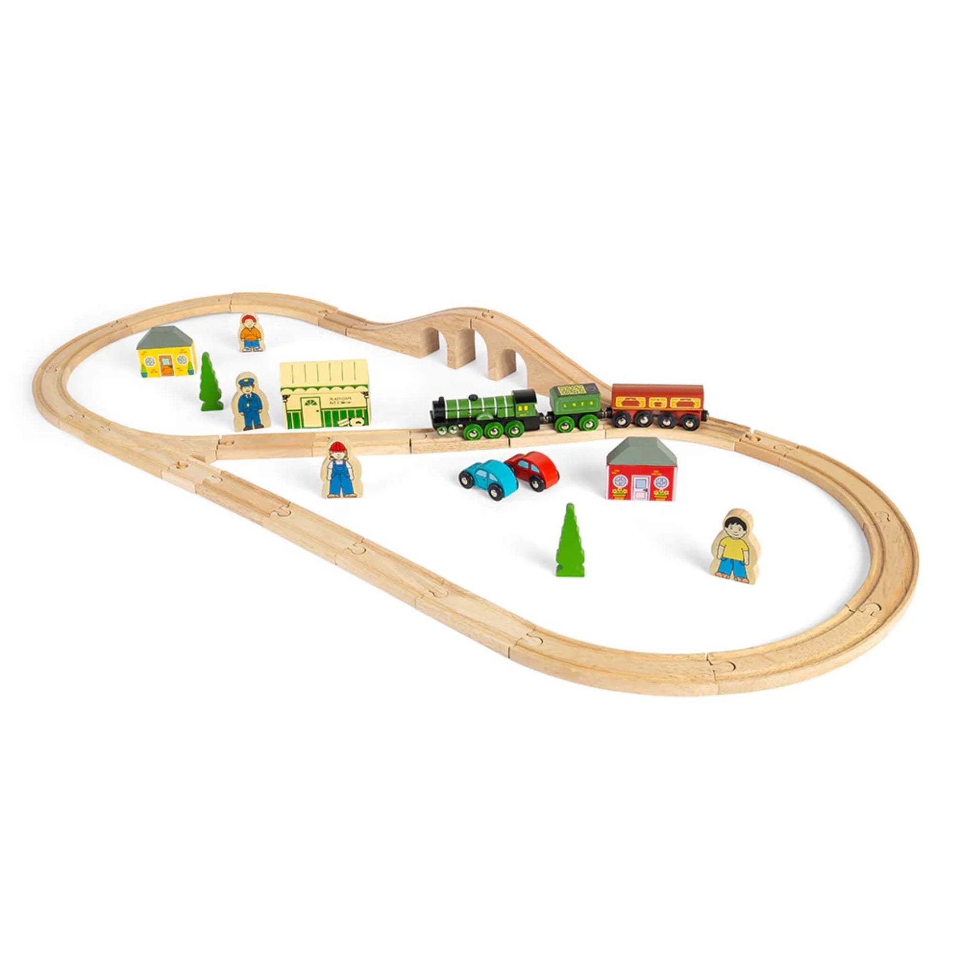 Angled view of the Bigjigs Flying Scotsman Set showing train crossing the bridge with station, cars, and accessories around the track.