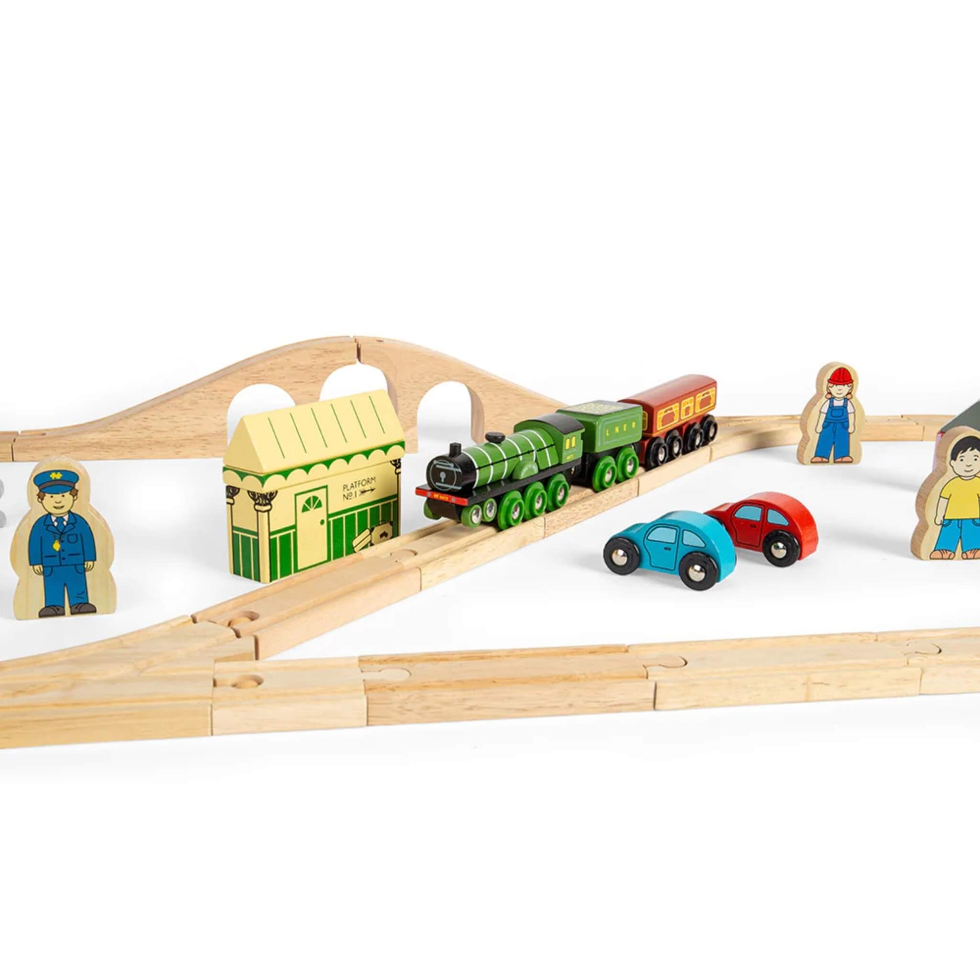 Flying Scotsman train set showing full bridge and station setup with wooden accessories and two small cars on the track.
