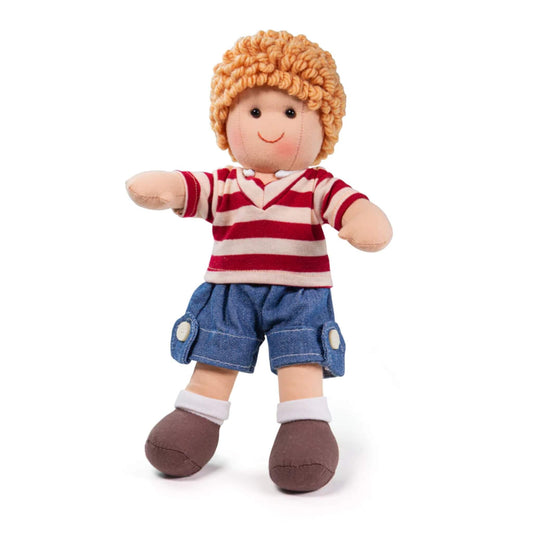 Soft ragdoll in red and white striped top and denim shorts with curly ginger hair. Bigjigs Toys Harry Doll Small.