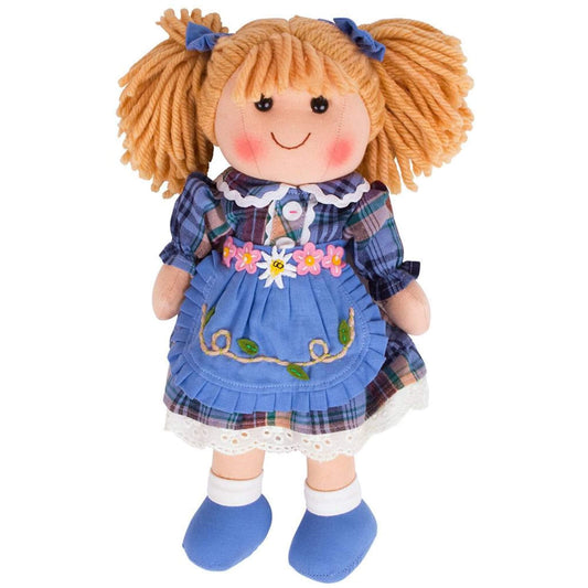Bigjigs Toys Katie Doll standing in a blue check dress with a floral apron, white socks and blue shoes, smiling with blonde pigtails and blue bows.