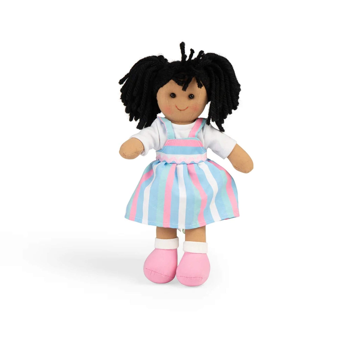 Front-facing image of the Kira doll wearing a white top with a pastel striped pinafore dress in pink, blue, and white, plus soft pink shoes.