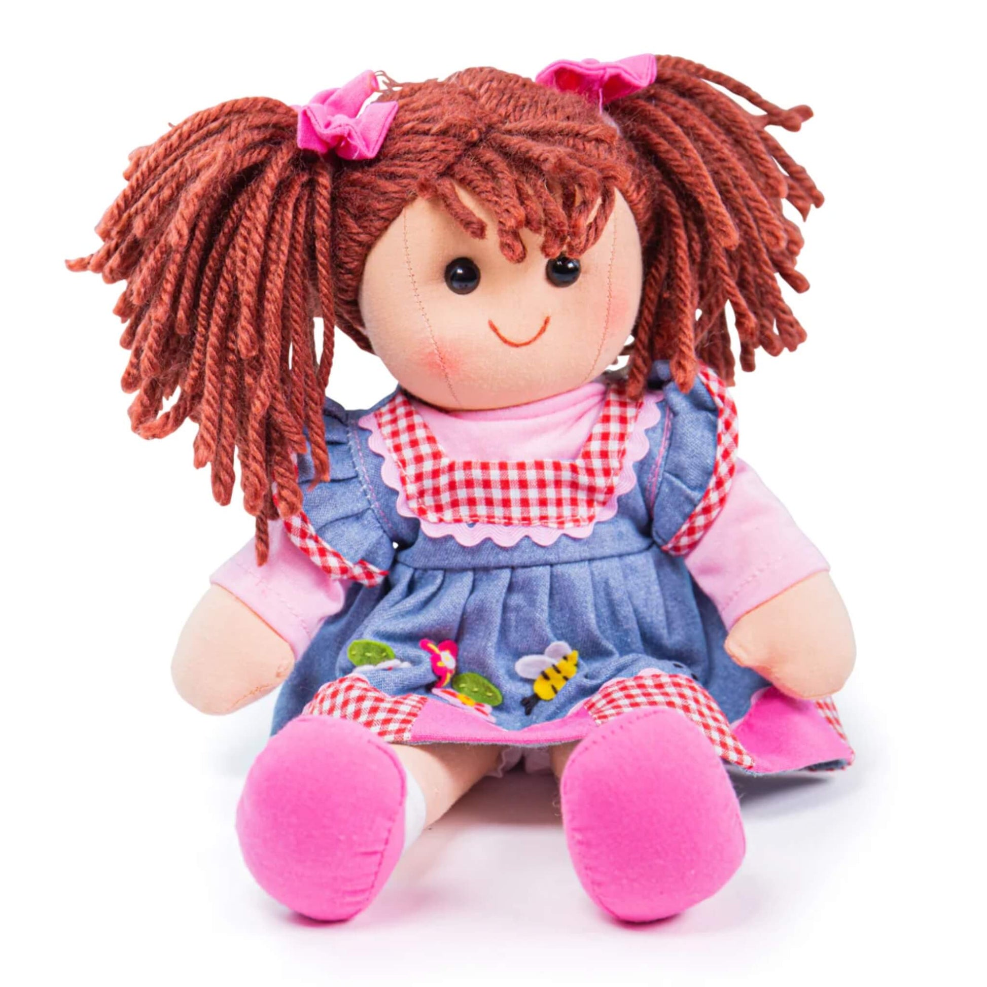 Melody Doll seated with a wide smile, twin yarn pigtails, and colourful embroidered flowers and bee detail on her blue dress.