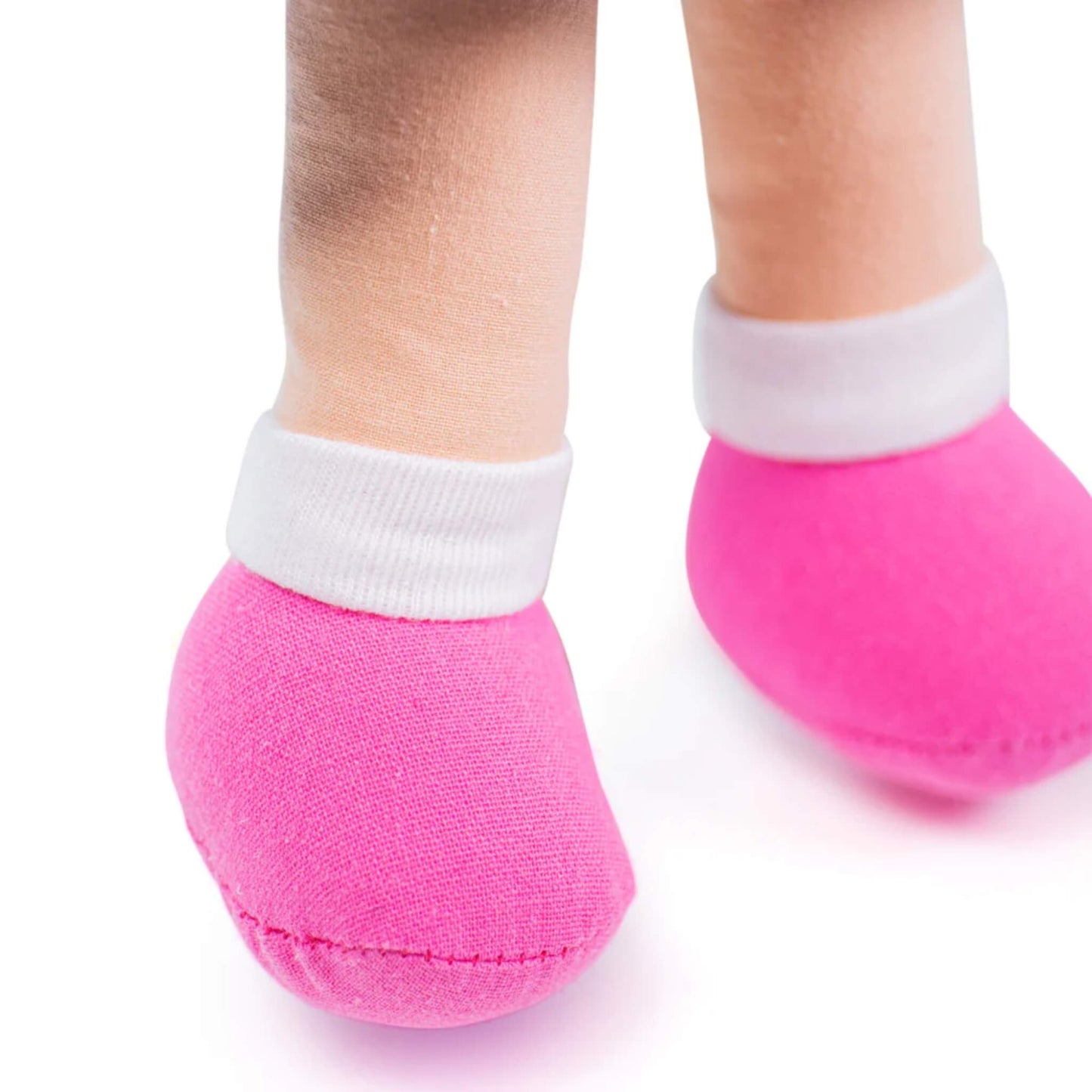 Detail shot of the pink shoes and white ankle cuffs on Melody Doll’s soft fabric feet.