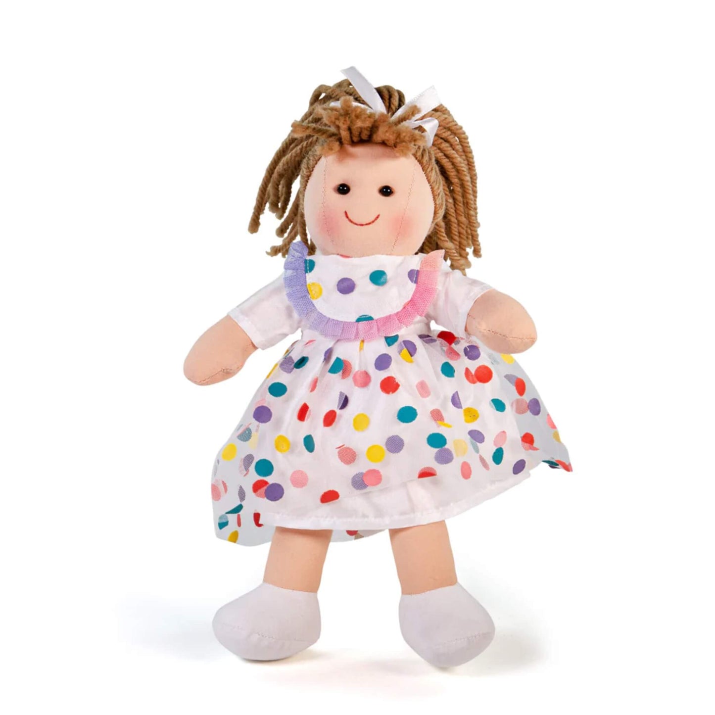 Bigjigs Toys Phoebe Doll shown standing, wearing a white dress with multicoloured polka dots and a matching frilly collar.
